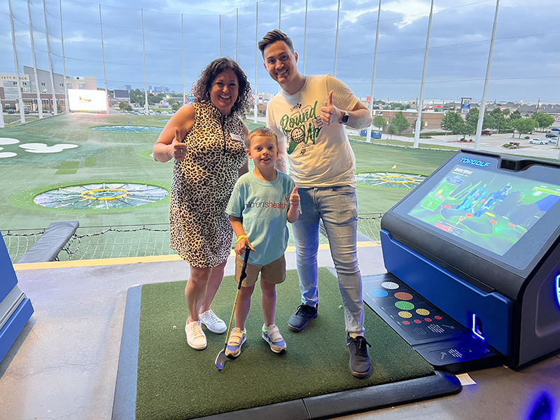 Family at a TopGolf event benefiting Children's Health