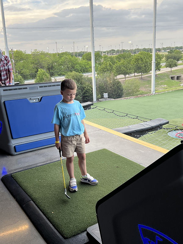 Child golfer at Children's Health TopGolf event