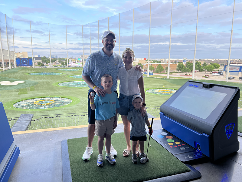 Family at a TopGolf event benefiting Children's Health [2]