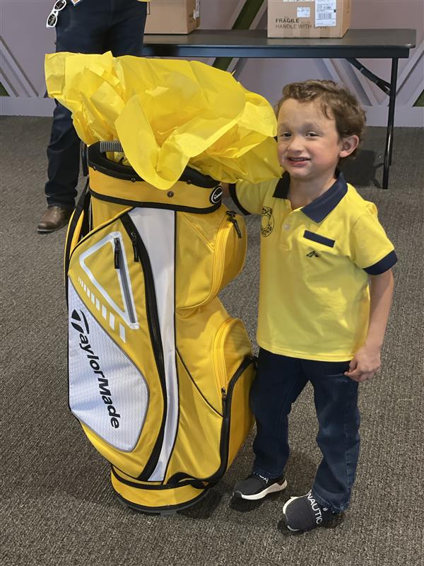 Child golfer at Children's Health Play yellow event